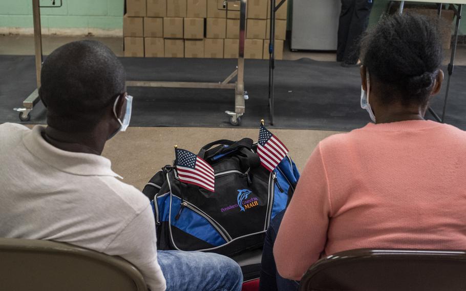 Migrants from Haiti await transportation June 26 at a shelter in Del Rio, Texas. MUST CREDIT: Photo for The Washington Post by Sergio Flores