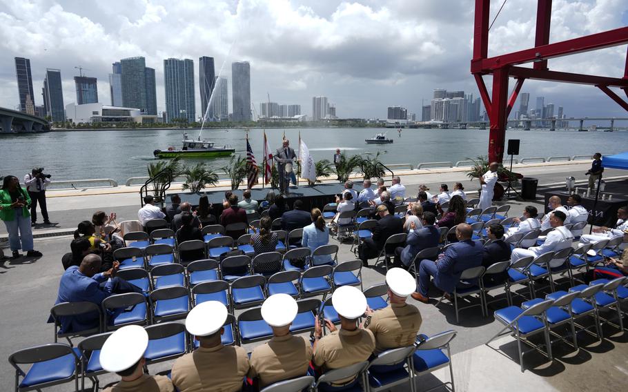 A Miami-Dade Fire Rescue boat sprays water as U.S. Secretary of the Navy Carlos Del Toro speaks during an event to announce that the Navy will hold its May 2024 Fleet Week in Miami, Friday, July 14, 2023, at PortMiami, in Miami. 