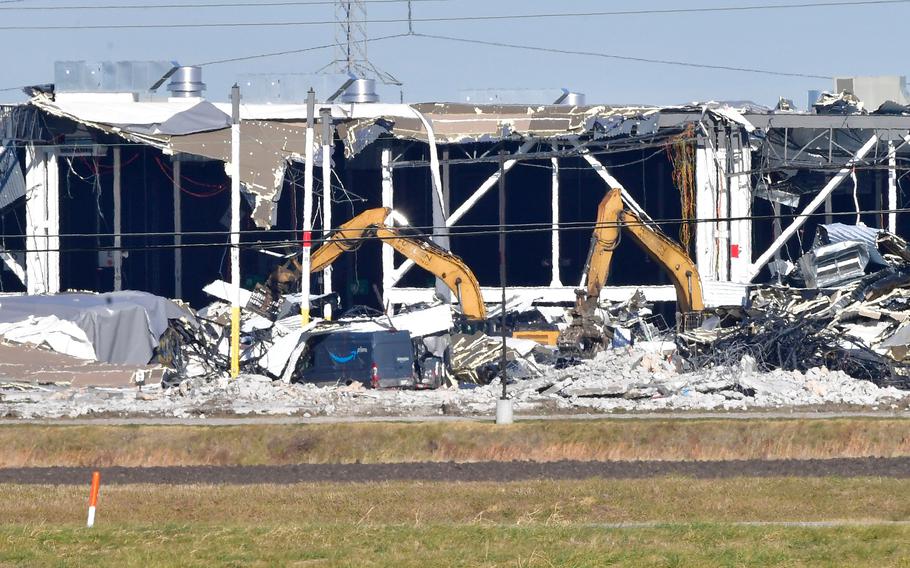 Recovery operations continue after the partial collapse of an Amazon Fulfillment Center in Edwardsville, Ill., on Dec. 12, 2021. The facility was damaged by a tornado on Dec. 10, 2021. The confirmed number of fatalities has been raised from two to six people.