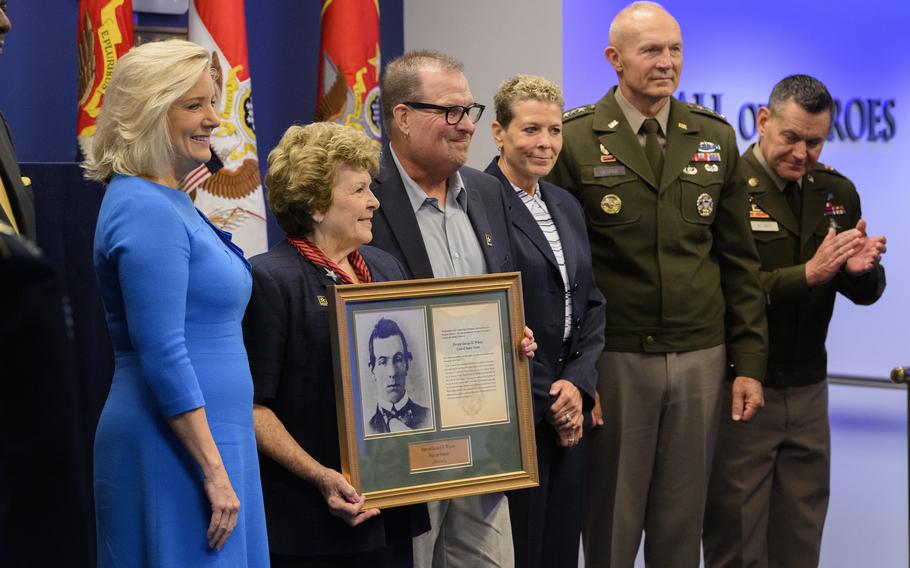 Secretary of the U.S. Army Christine E. Wormuth presents the Medal of Honor plaque to Theresa Chandler, the great-great-granddaughter of U.S. Army Pvt. George D. Wilson, during the Hall of Heroes Induction Ceremony and Virtual Medal of Honor Wall Museum Unveiling at the Pentagon in Arlington, Va., July 4, 2024. 