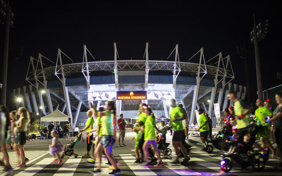 Runners of all ages take part in a neon fun run at Atago Sports Complex in Iwakuni city, Japan, Saturday, June 24, 2023.