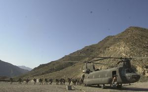 Asadabad, Afghanistan, Oct. 15, 2004: Soldiers with the 82nd Airborne Division get on a CH-47 Chinook on their way to an air assault. Helicopters inserted the soldiers onto a hilltop 8,000 feet into the mountains near the Afghanistan/Pakistan border.

Read Terry Boyd's story on the air assault here https://www.stripes.com/news/troops-stage-assaults-on-insurgents-in-afghanistan-1.25112

META TAGS: Afghanistan, Operation Enduring Freedom, Wars on Terror, U.S. Army, Airborne