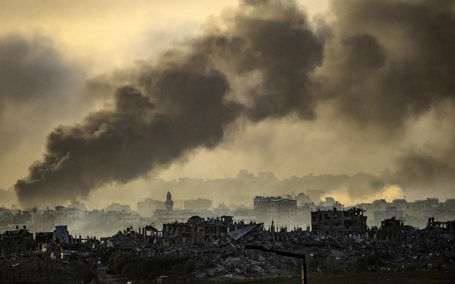 This picture, taken from the Israeli side of the border with the Gaza Strip, shows smoke rising above buildings during Israeli strikes on the northern part of the Palestinian enclave on Wednesday, Nov. 22, 2023, as battles between Israel and the Hamas movement continue.