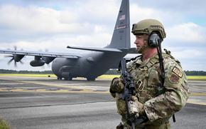 Air Force 2nd Lt. Kenneth Mantle of the Georgia Air National Guard conducts airfield security while a C-130 Hercules is unloaded May 10, 2023, at Joint Base Charleston, S.C., while preparing for the exercise Air Defender 2023, led by the German air force.