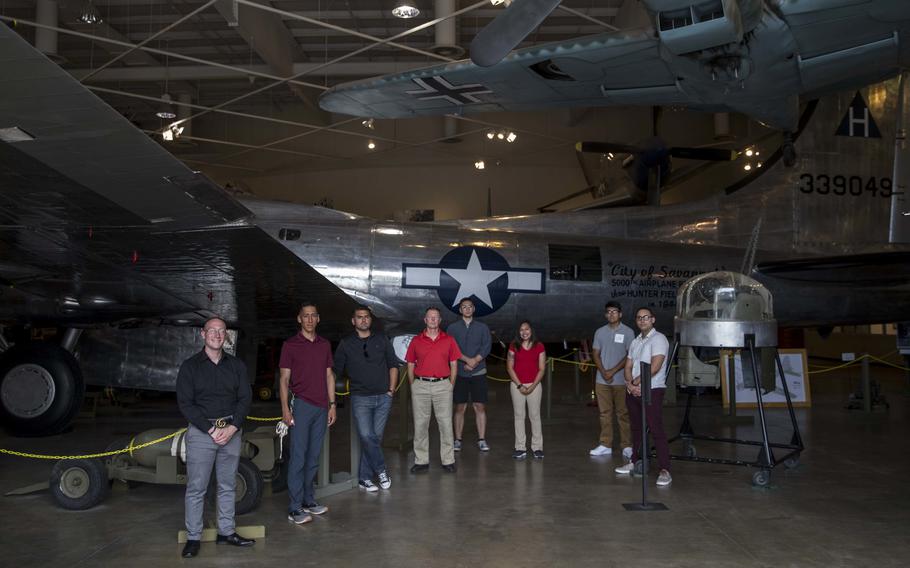 U.S. Marines with 6th Marine Corps District pose for a group photo next to the "City of Savannah" Boeing B-17 Flying Fortress on display at the Mighty Eighth Air Force Museum in Pooler, Georgia on June 5, 2020.