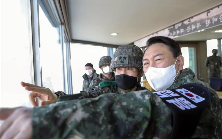 Yoon Seok-youl, right, who will take office as South Korea's 20th president on May 10, 2022, visits the Demilitarized Zone, Dec. 20, 2021.