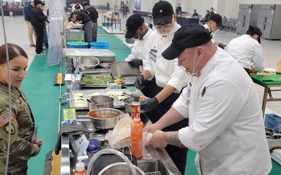 A culinary team from the 581st Quartermaster Company, 2nd Sustainment Brigade, 2nd Infantry Division prepare their special cuisine during an  international military cooking competition in Seoul, South Korea, Nov. 7, 2023. 