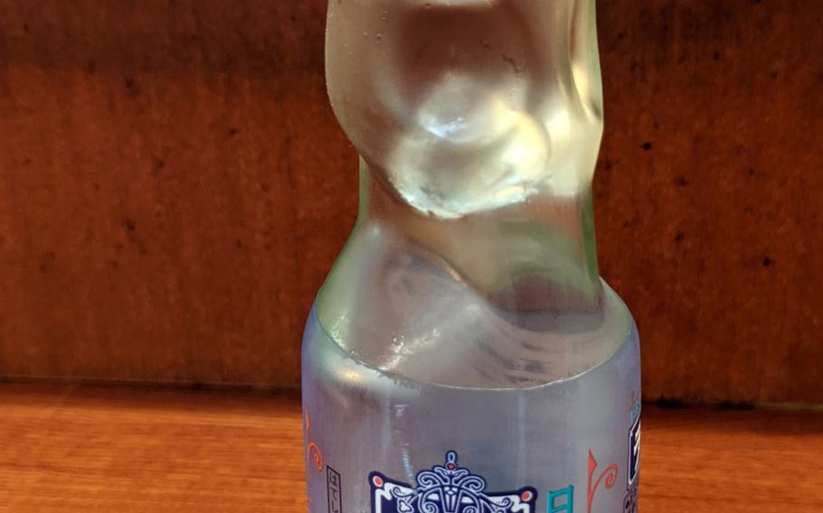 Ramune is a refreshing Japanese beverage often enjoyed by children in the summertime. 