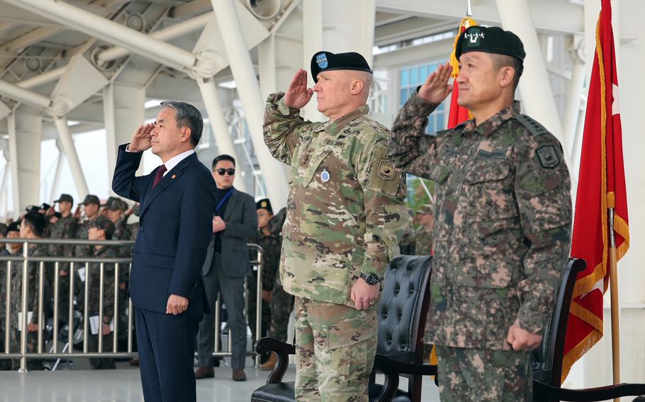 South Korean Defense Minister Lee Jong-sup, left, U.S. Forces Korea commander Gen. Paul LaCamera, center, and South Korean Gen. Ahn Byung-seok attend the opening ceremony of the Combined Forces Command headquarters at Camp Humphreys, South Korea, Nov. 15, 2022. 