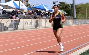 Well ahead of the field, Humphreys sophomore Cassandra Jarzabek makes her way down the home stretch of her Pacific record-breaking 1,600-meter run.