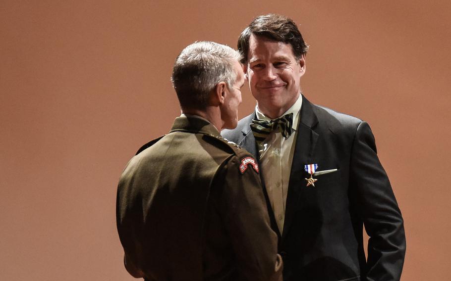 Jeff Struecker is presented the Silver Star on Friday, Oct. 1, 2021 at Fort Benning, Ga., by Army Gen. Richard Clarke, head of U.S. Special Operations Command for actions in the infamous October 1993 Battle of Mogadishu. Struecker was a staff sergeant and squad leader with the Army’s 3rd Battalion, 75th Ranger Regiment during the battle made famous by the book and movie “Black Hawk Down.” 