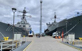The destroyer USS Paul Ignatius, left, and the amphibious command ship USS Mount Whitney are moored side by side in Tallinn, Estonia, on Saturday, June 2, 2023. The ships are among 50 vessels from 20 countries taking part in BALTOPS, an annual maritime exercise in the Baltic Sea.