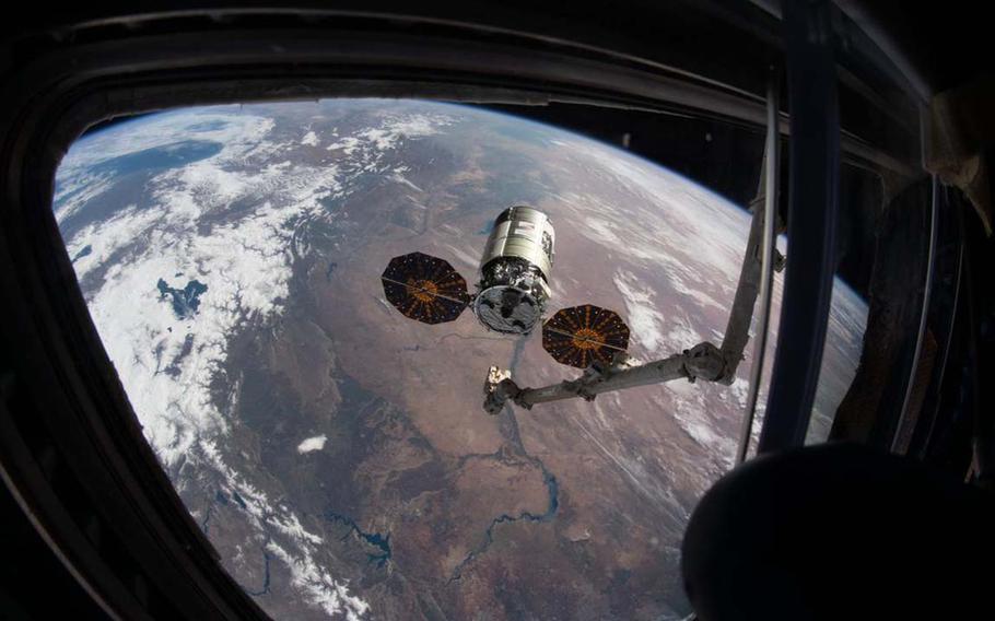 This file image shows Northrop Grumman’s Cygnus cargo spacecraft as it is grabbed by the Canadarm2 robotic arm at the International Space Station.