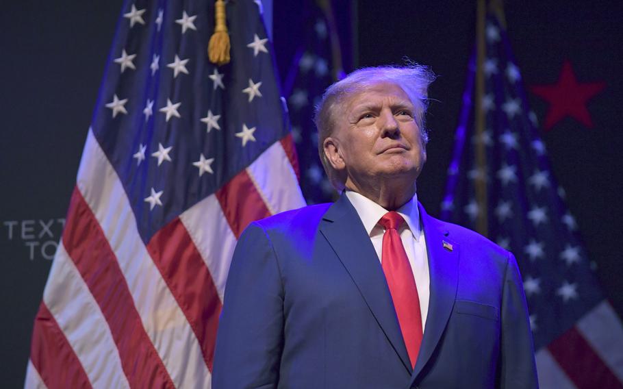 Former President Donald Trump pauses as he speaks at a campaign event Monday, March 13, 2023, in Davenport, Iowa. 