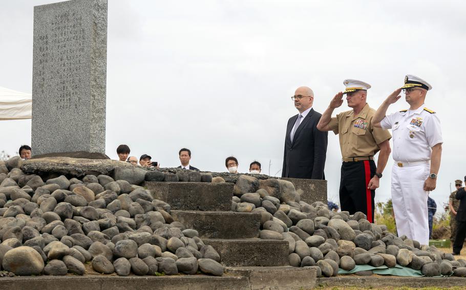 Lt. Gen. Roger Turner, center, commander of III Marine Expeditionary Force, Rear Adm. Carl Lahti, right, commander of U.S. Naval Forces Japan, and Raymond Greene, U.S. deputy chief of mission to Japan, salute the Reunion of Honor monument on Iwo To, Japan, March 30, 2024.