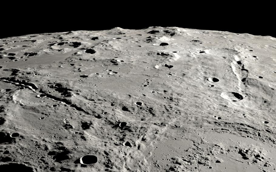 A view from orbit looking across the surface of the moon.