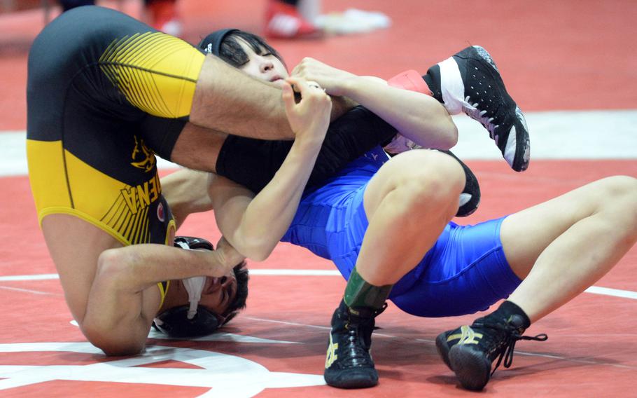 Shonan Military Academy's Hanano Ohya uses a leg lace to tilt Kadena's Cedric Ferguson in the 107-pound final. Ohya won by 10-0 technical fall and also earned the tournament's Outstanding Wrestler award.