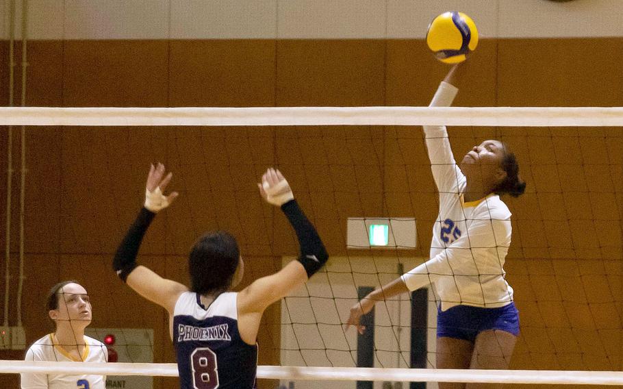 Yokota’s Trinity Stegall spikes against Seisen International’s Linnea Rocha during the Phoenix’ three-set victory over the Panthers during Friday’s American School In Japan YUJO Tournament pool-play match.