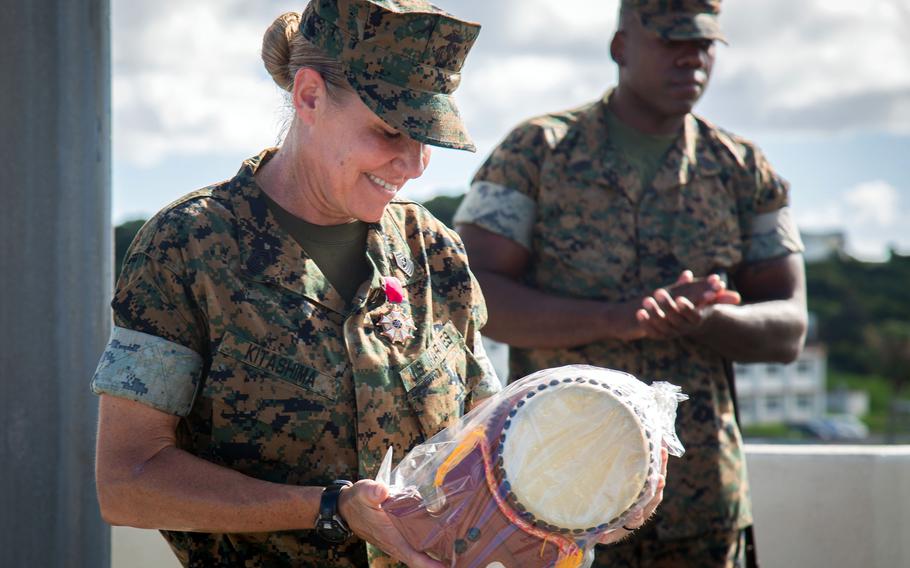 Sgt. Maj. Joy Kitashima receives a gift at Camp Foster, Okinawa, June 23, 2022.