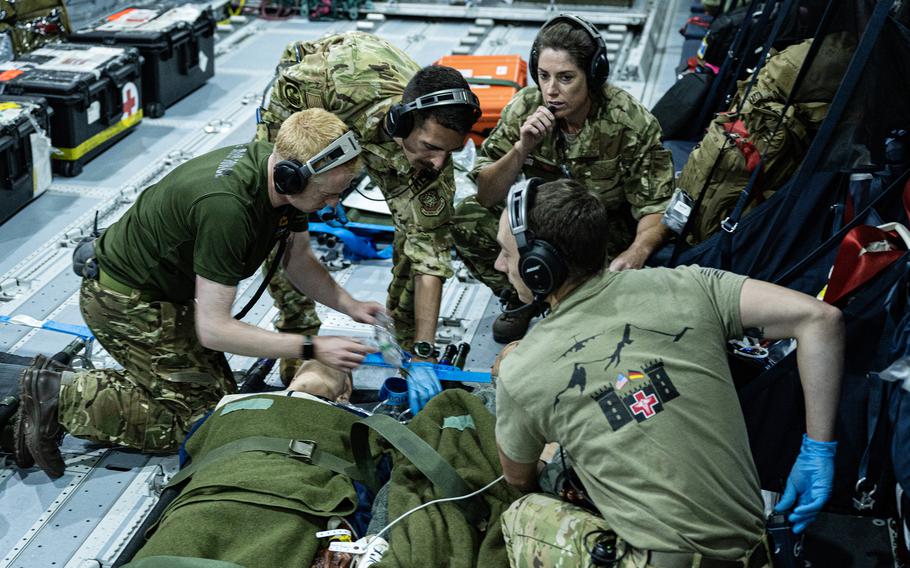 U.S. and British airmen carry out medical training aboard Royal Air Force A400M Atlas over Andersen Air Force Base, Guam, July 14, 2023. The drill was part of Mobility Guardian 23. 