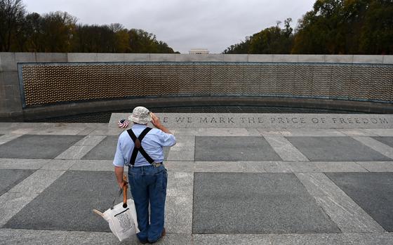 Vietnam veteran Bernie Klemanek, of Mineral, Va., salutes while visiting the World War II Memorial on Veterans Day in 2020. MUST CREDIT: Matt McClain/The Washington Post