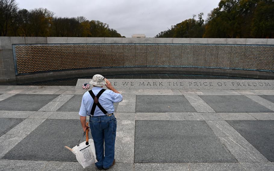 Vietnam veteran Bernie Klemanek, of Mineral, Va., salutes while visiting the World War II Memorial on Veterans Day in 2020. 