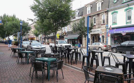 Outdoor tables on Bridge Street in Phoenixville, Pa. Some business owners and residents are frustrated with the town’s popular outdoor drinking and dining series PXV Inside Out: Born from pandemic lockdowns, each weekend between May and October, the Chester County borough closes off two blocks along Bridge Street, its main business strip, for pedestrians to eat, drink and shop, free from cars.