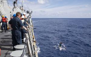 Sailors aboard the guided-missile destroyer USS Ralph Johnson provided food and water to a group of Filipino fishermen in the South China Sea, Aug. 14, 2023.