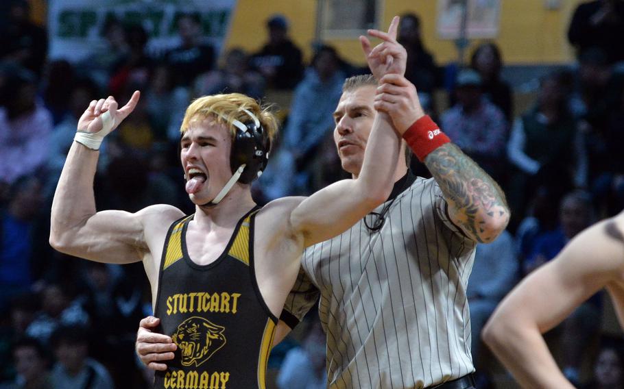 Stuttgart’s Zachary Call celebrates his 144-pound title after defeating Wiesbaden’s Jacob Lane at the DODEA-Europe wrestling championships, in Wiesbaden, Germany, Feb. 11, 2023. 