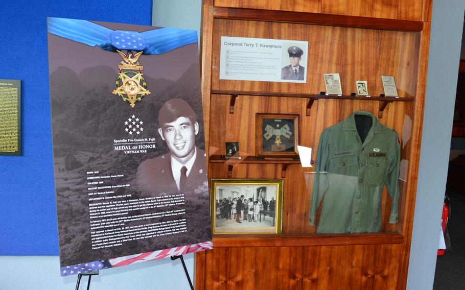 A display at the Gallery of Heroes at the Army Museum of Hawaii in Honolulu shows artifacts from the lives of its two newest inductees, Dennis Fujii and Edward Kaneshiro, who were awarded the Medal of Honor in 2022 for actions during the Vietnam War.