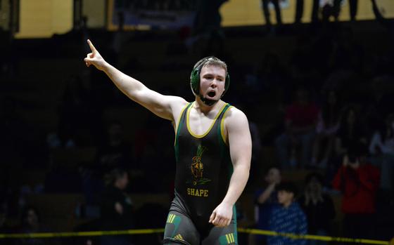 SHAPE’s William Bush celebrates his 215-pound title after defeating Stuttgart’s Conner Hutchinson at the DODEA-Europe wrestling finals in Wiesbaden, Germany, Feb. 10, 2024.