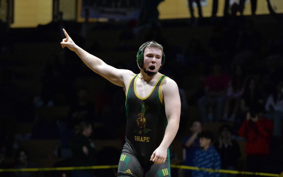 SHAPE’s William Bush celebrates his 215-pound title after defeating Stuttgart’s Conner Hutchinson at the DODEA-Europe wrestling finals in Wiesbaden, Germany, Feb. 10, 2024.