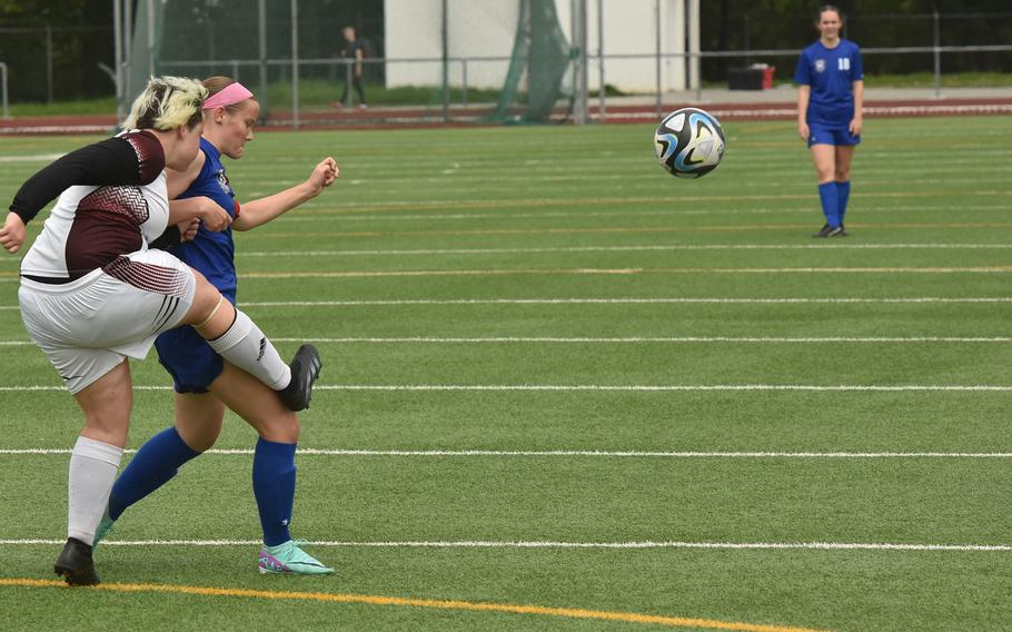 Vilseck junior Phoebe-Sue Dean clears the ball away from Wiesbaden's Rylee Ashcraft during a game in Wiesbaden, Germany, on May 4, 2024. 