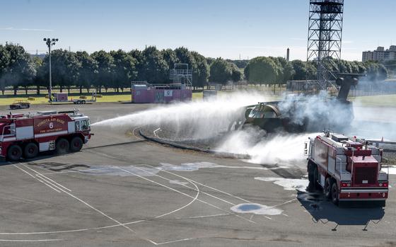 U.S. and Japanese military firefighters train together at Yokota Air Base, Japan, Oct. 26, 2022.