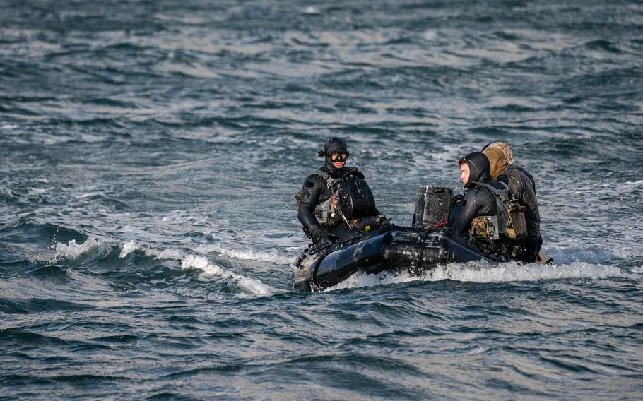 SEALs make their way back from a combat swimmer infiltration training at Coast Guard Air Station Kodiak on Feb. 28.