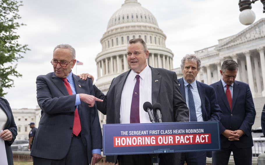 From left, Sens. Chuck Schumer, D-N.Y., Jon Tester, D-Mont., Sherrod Brown, D-Ohio, and Martin Heinrich, D-N.M., at the press conference Thursday, June 16, 2022, that included veteran advocates and Comedian Jon Stewart.