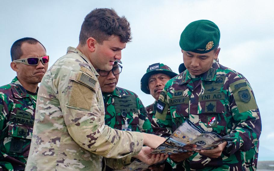 U.S. Army Lt. Jared McCully speaks to Indonesian service members outside the Flagstaff Hill Cafe in Bowen, Australia, Thursday, July 27, 2023.