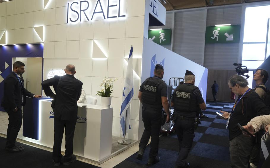 Riot police officers patrol by the Israeli pavilions at the Paris Air Show, Monday, June 16, 2025 in Le Bourget, north of Paris. 