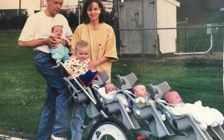 Retired Marine Corps Brig. Gen. Frank Kelley poses for a picture walking through the neighborhood streets with his wife, Traci, their five children and one on the way. 