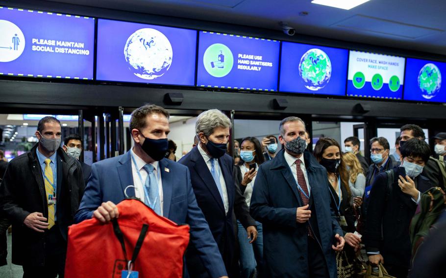 John Kerry, U.S special presidential envoy for climate, center, during the COP26 climate talks in Glasgow, U.K., on Nov. 1, 2021.