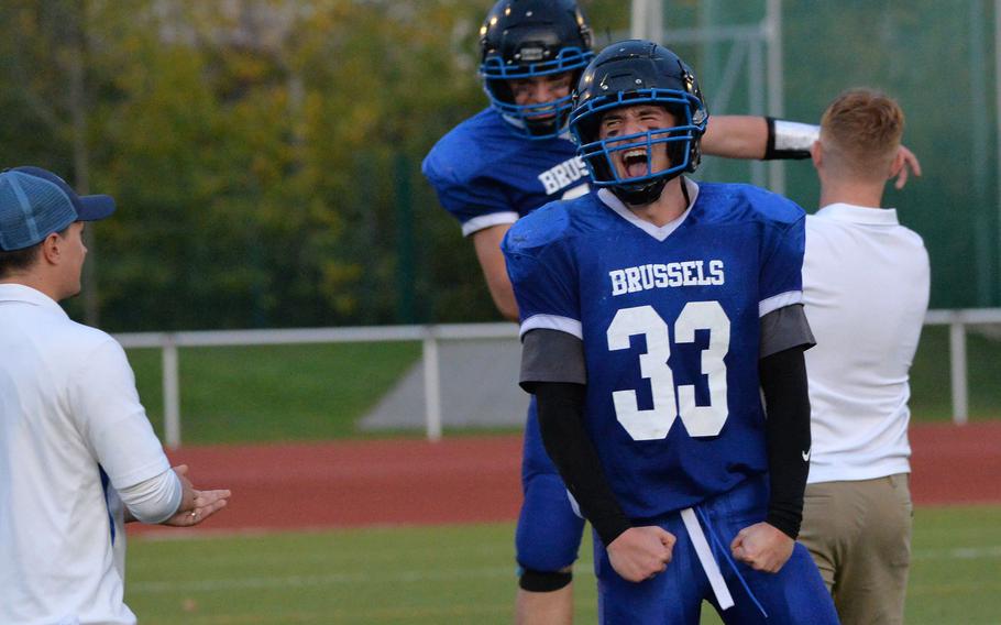 William Pierce and and Sawyer Ter Horst of Brussels celebrate a 64-48 win over Spangdahlem in the DODEA-Europe Division III football final at Kaiserslautern, Germany, Oct. 29, 2022.