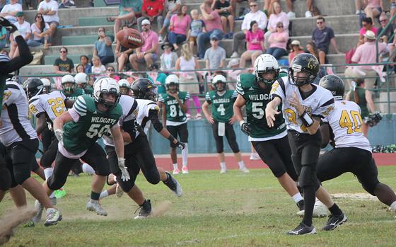 Vicenza quarterback Logan Sistare gets a pass off before Naples defenders are able to close in Saturday, Oct. 8, 2022, in the Wildcats' 42-0 victory over the Cougars.