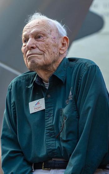 A photo of an older man looking forward.