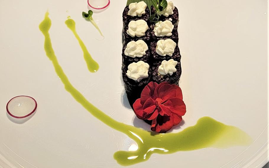 Kashima Sushi serves a delectable assortment of sushi rolls. This is the black rice roll with avocado and cream cheese.