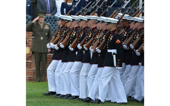 Joint Base Myer-Henderson, Virginia, Sept. 25, 2015: Gen. Joseph Dunford Jr. salutes as Marines march past during a farewell ceremony for Dunford's predecessor as chairman of the Joint Chiefs of Staff, Gen. Martin Dempsey, at Joint Base Myer-Henderson.

META TAGS: USMC; U.S. Marine Corps; change of command; ceremony
