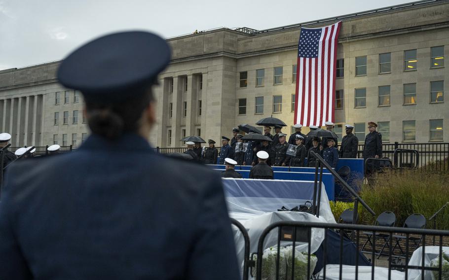 Pentagon officials unfurled an American flag over the side of the Pentagon on Monday, Sept. 11, 2023, at sunrise at an observance ceremony at the National 9/11 Pentagon Memorial to honor the 184 lives lost in the 2001 terrorist attack on the Pentagon. 