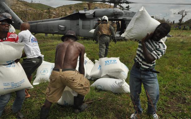 Hed: Delivering hope and sustenance, 2016

Villagers work with Navy pilots and Marines to offload relief supplies from a Navy helicopter delivered to the village of Jabouin in southwest Haiti on Oct. 18. The village was badly hit by Hurricane Matthew two weeks ago, which destroyed homes and crops, leaving many people unsheltered and without food or livelihood.

Read the story here
https://www.stripes.com/news/2016-10-21/navy-veteran-among-those-treating-injuries-distributing-food-for-haitians-who-lost-everything-in-storm-1550347.html1

META TAGS: U.S. Navy; USMC; U.S. Marine Corps; Haiti; natural disaster; humanitarian aid; international aid; 