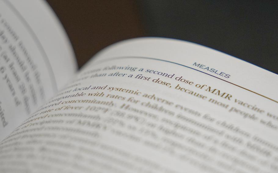 A section on measles is visible in the American Academy of Pediatrics Red Book seen at Hobbs Medical Clinic Monday, Feb. 24, 2025, in Hobbs, N.M.