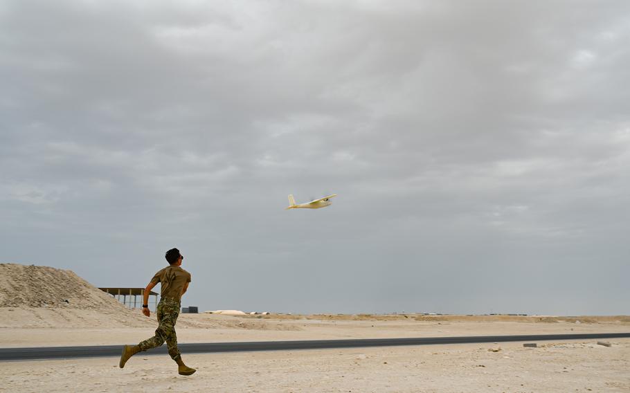 An airman assigned to U.S. Air Forces Central’s Task Force-99 launches a newly developed unmanned aerial system March 15, 2024. The drones were designed, printed and flying in less than 48 hours.