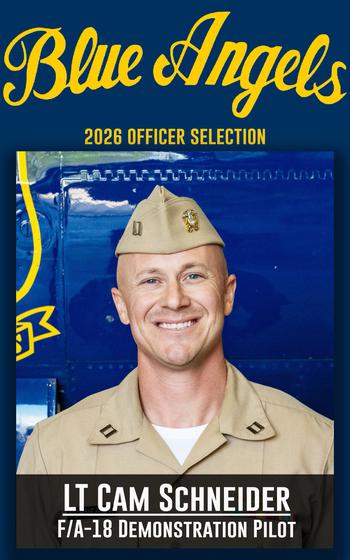 A service member smiles for a photo